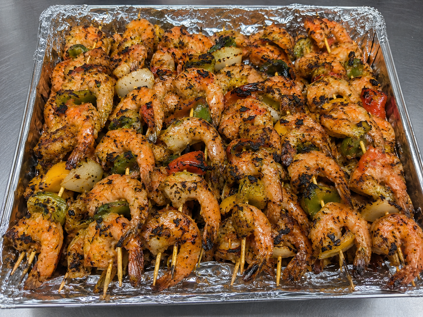 Catering tray with grilled shrimp skewers